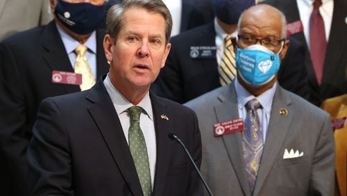 Gov. Brian Kemp, presents legislation to overhaul Georgia’s citizen's arrest statute during a press conference at the Capitol. Standing with him is Democratic state Rep. Calvin Smyre, a co-sponsor of the proposal, House Bill 479. Curtis Compton / Curtis.Compton@ajc.com”