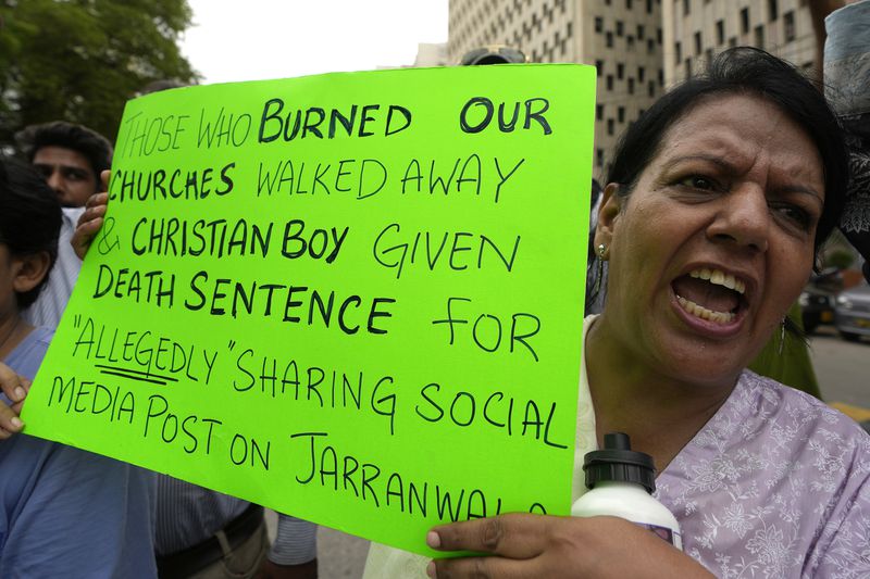 A member from Pakistan's minority community chants slogans during a demonstration against the conviction of a Christian man on charges of blasphemy and condemn the country's blasphemy laws, Tuesday, July 2, 2024. A court had awarded a death sentence to Ehsan Shan after finding him guilty of sharing "hateful content against Muslims on social media after one of the worst mob attacks on Christians in the eastern Punjab province last year. (AP Photo/Fareed Khan)