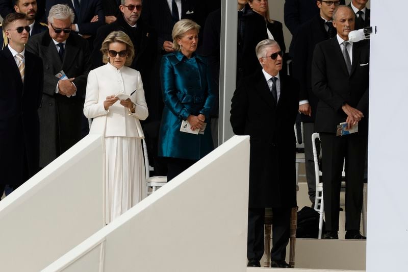 Queen Mathilde, left, and King Philippe listen Pope Francis as he presides the holy mass , at the King Baudouin stadium in Brussels, Belgium, Sunday, Sept. 29, 2024. (AP Photo/Omar Havana)