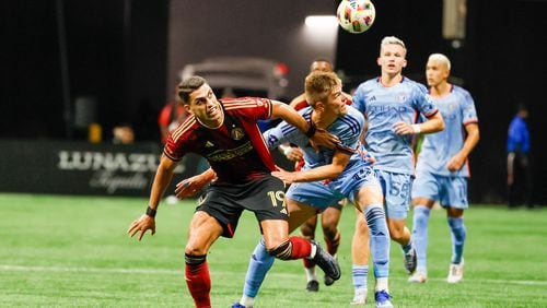 Atlanta United forward Daniel Ríos (19) battles for the ball against New York City defender Strahinja Tanasijević (12) during the first half against New Yor City at Mercedes-Benz Stadium on Wednesday, July 17, 2024. 
(Miguel Martinez/ AJC)