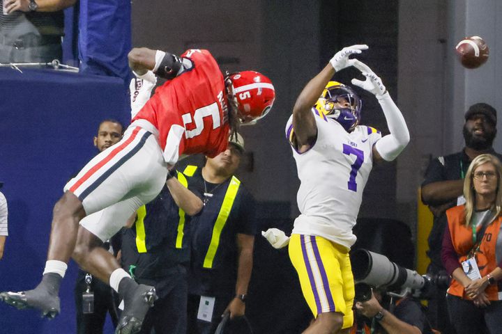 Georgia Bulldogs defensive back Kelee Ringo (5) blocks an attempted pass to LSU Tigers wide receiver Kayshon Boutte (7) during the first half of the SEC Championship Game at Mercedes-Benz Stadium in Atlanta on Saturday, Dec. 3, 2022. (Bob Andres / Bob Andres for the Atlanta Constitution)