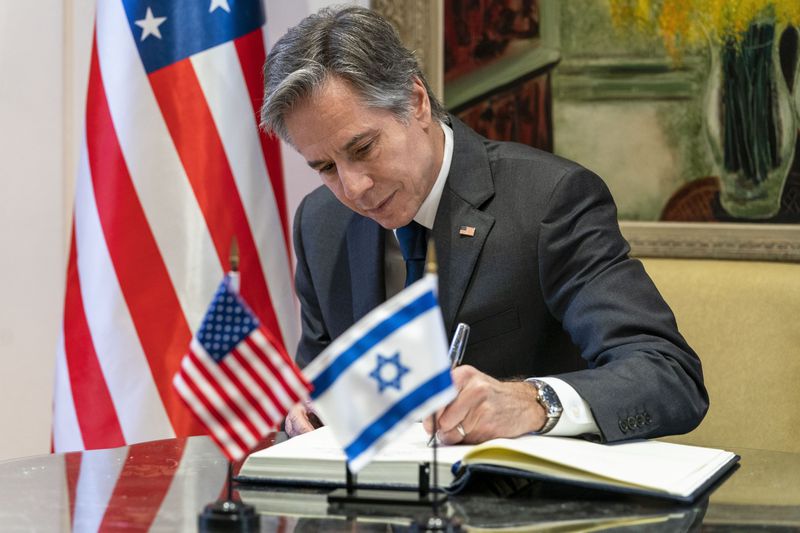 FILE - U.S. Secretary of State Antony Blinken signs a guest book before his meeting with Israel's President Isaac Herzog at the Presidency, Sunday, March 27, 2022, in Jerusalem. (AP Photo/Jacquelyn Martin, Pool, File)