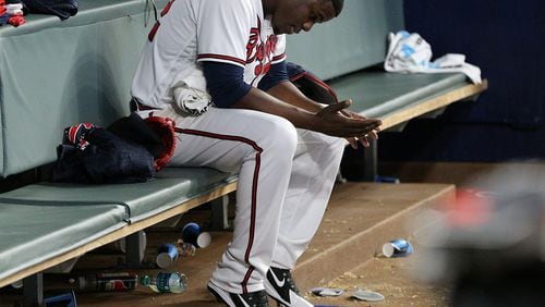 Braves reliever Jose Ramirez sits dejected after giving up four runs in the 10th inning of a 5-1 loss to the Phillies on April 17. He went on the 10-day disabled list the following day. (Curtis Compton/ccompton@ajc.com)