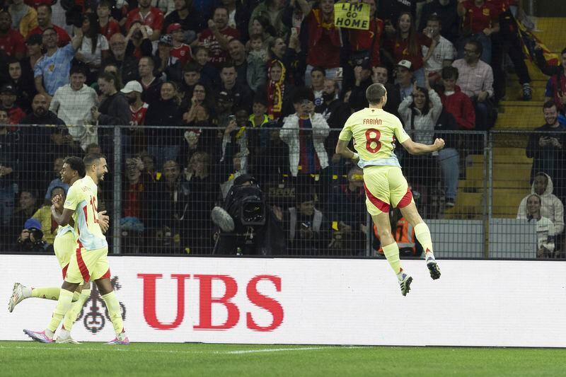 Spain's midfielder Fabian Ruiz, right, celebrates his goal during the Nations League group A4 qualifying soccer match between Switzerland and Spain, at the Stade de Geneve, in Geneva, Switzerland, Sunday, Sept. 8, 2024. (Salvatore Di Nolfi/Keystone via AP)