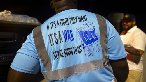 Longshoremen strike at midnight at Bayport Terminal on Tuesday, Oct. 1, 2024, in Houston. (AP Photo/Annie Mulligan)