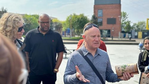 The Rev. Gary Mason talks to a group of U.S. faith leaders at one of Belfast’s “peace walls.” Peace walls still divide communities in Belfast but are now adorned with messages of hope.