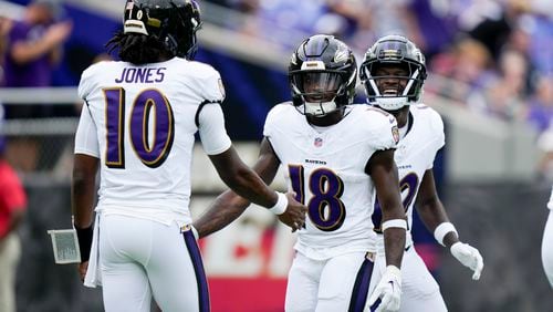 Baltimore Ravens wide receiver Dayton Wade celebrates after scoring with quarterback Emory Jones during the second half of a preseason NFL football game on Saturday, Aug. 17, 2024, in Baltimore. (AP Photo/Stephanie Scarbrough)