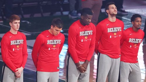 Hawks players (from left) Kevin Huerter, Bogdan Bogdanovic, Clint Capela, Danilo Gallinari and Lou Williams stand during the National Anthem on Friday, June 25, 2021, in Milwaukee.   “Curtis Compton / Curtis.Compton@ajc.com”