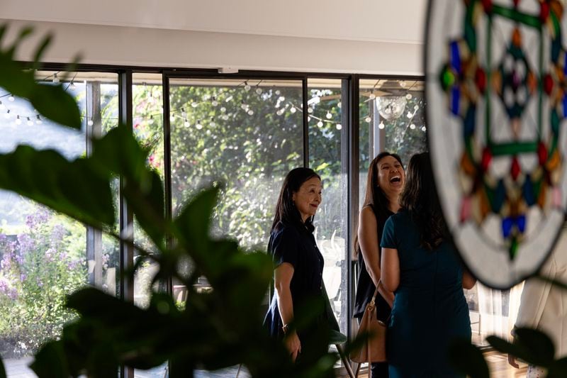 Asian Texans for Justice co-founder Alice Yi (left) talks with Jocelyn Tau, district director for U.S. Rep. Lloyd Doggett in Austin, Texas, on June 21, 2024. (Photo by Eliana Alzate/News21)