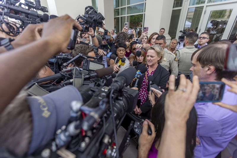 Prosecutor Kari Morrissey addresses the media after District Court Judge Mary Marlowe Sommer threw out the involuntary manslaughter case against actor Alec Baldwin for the 2021 fatal shooting of cinematographer Halyna Hutchins during filming of the Western movie "Rust," Friday, July 12, 2024, in Santa Fe, N.M. (Luis Sánchez Saturno/Santa Fe New Mexican via AP)