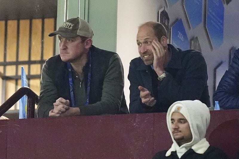 Britain's Prince William, top right, watches during the Champions League opening phase soccer match between Aston Villa and Bayern Munich at Villa Park in Birmingham, England, Wednesday, Oct. 2, 2024. (Mike Egerton/PA via AP)