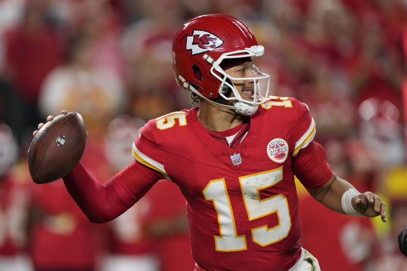 Kansas City Chiefs quarterback Patrick Mahomes (15) throws during the second half of an NFL football game against the Baltimore Ravens Thursday, Sept. 5, 2024, in Kansas City, Mo. (AP Photo/Charlie Riedel)