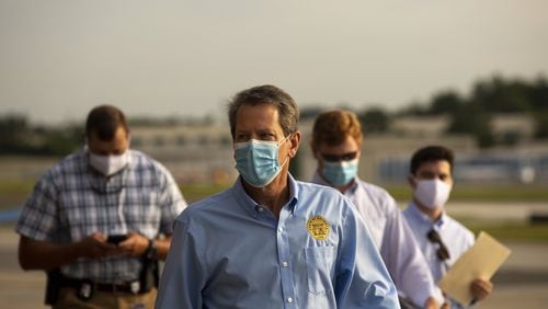 Georgia Gov. Brian Kemp prepares to speak at the start of a “Wear A Mask” tour. (REBECCA WRIGHT FOR THE ATLANTA JOURNAL-CONSTITUTION)