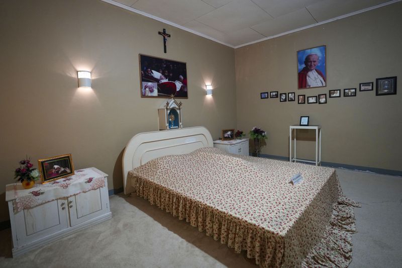 Portraits of Pope John Paul II are displayed in a room where he stayed during his visit in 1989, at Ritapiret Major Seminary in Maumere, East NusaTenggara province, Indonesia, Friday, Aug. 23, 2024. (AP Photo/Tatan Syuflana)