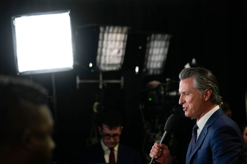 FILE - California Gov. Gavin Newsom speaks to reporters in the spin room before a presidential debate between Republican presidential nominee former President Donald Trump and Democratic presidential nominee Vice President Kamala Harris, Tuesday, Sept. 10, 2024, in Philadelphia. (AP Photo/Matt Rourke, File)