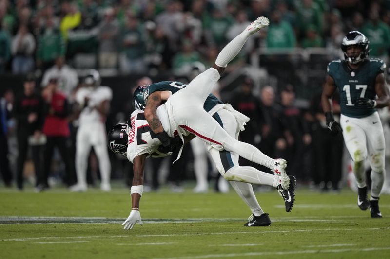 Atlanta Falcons wide receiver Ray-Ray McCloud III (34) is tackled by Philadelphia Eagles linebacker Zack Baun (53) after a catch during the second half of an NFL football game Monday, Sept. 16, 2024, in Philadelphia. (AP Photo/Matt Slocum)