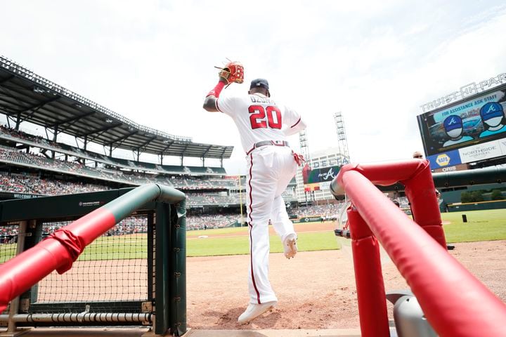 Braves left fielder Marcell Ozuna heads toward the outfield Sunday against the Astros at Truist Park. (Miguel Martinez / miguel.martinezjimenez@ajc.com)