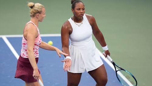 Katerina Siniakova, of the Czech Republic, and Taylor Townsend, of the United States, react during a second round match of the U.S. Open tennis championships, Thursday, Aug. 29, 2024, in New York. (AP Photo/Frank Franklin II)