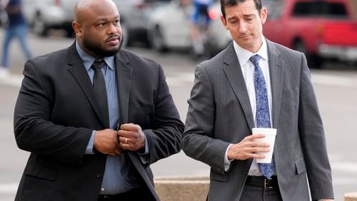 Former Memphis police officer Desmond Mills, left, arrives at the federal courthouse with his attorney Blake Ballin, right, to testify against his former colleagues during the trial in the Tyre Nichols case Wednesday, Sept. 25, 2024, in Memphis, Tenn. (AP Photo/George Walker IV)