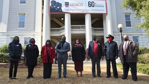 Eight people who rang the Chapel Bell (from left) Autumn Pressley, Yvette Daniels, Ericka Davis, Jeff Brown, Shontel Cargill, Ken Dious, Horace King and Hamilton Holmes Jr. pose for a group photograph outside the Holmes-Hunter Academic Building on the campus in Athens on Saturday, January 9, 2021. On January 9, 1961, two courageous students, Hamilton Holmes and Charlayne Hunter, took heroic steps on the University of GeorgiaÕs campus to enroll as students followed by Mary Frances Early, who entered graduate school that summer. Their legacies continue as they have contributed a lifetime of public service to their communities. Because of these students, the university now boasts a diverse campus made of numerous nationalities, races and ethnicities. (Hyosub Shin / Hyosub.Shin@ajc.com)
