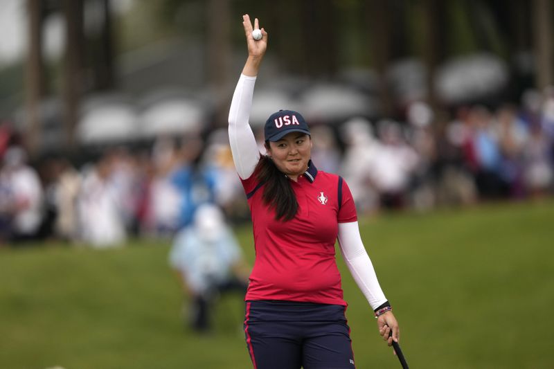 United States' Allisen Corpuz celebrates on the 16th green after winning foursomes match during a Solheim Cup golf tournament at Robert Trent Jones Golf Club, Friday, Sept. 13, 2024, in Gainesville, Va. (AP Photo/Matt York)