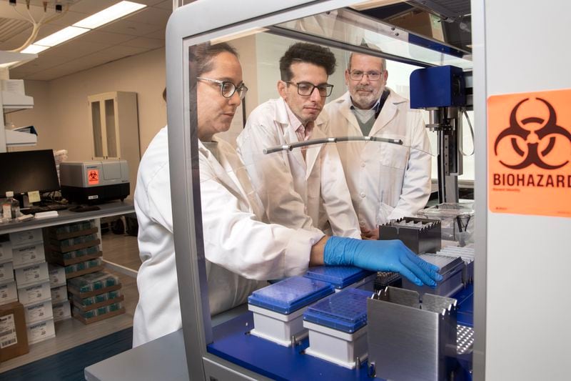 Emory researchers Lorena Chaves, Jose Assumpcao and Philip Santangelo (left to right) will be part of a collaborative effort to identify new mRNA drugs to enhance the body's immune response.
Photo credit: Jack Kearse