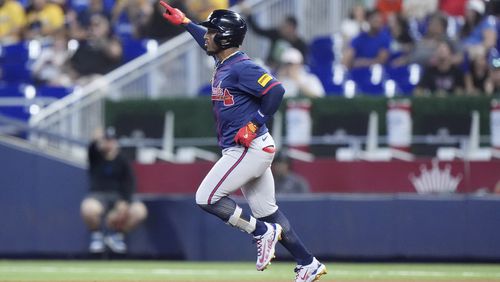 Atlanta Braves' Ozzi Albies heads to second base as he hits a home run during the first inning of a baseball game against the Miami Marlins, Sunday, Sept. 22, 2024, in Miami. (AP Photo/Wilfredo Lee)