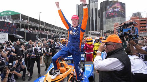 Scott Dixon celebrates winning the IndyCar Detroit Grand Prix auto race in Detroit, Sunday, June 2, 2024. (AP Photo/Paul Sancya)