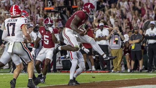 Alabama quarterback Jalen Milroe (4) scores on a running play against Georgia during the first half of an NCAA college football game, Saturday, Sept. 28, 2024, in Tuscaloosa, Ala. (AP Photo/Vasha Hunt)