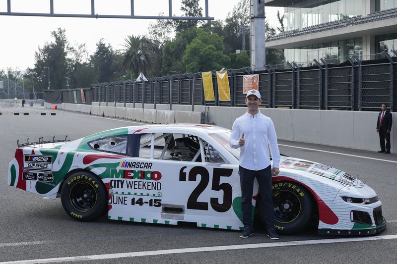 NASCAR driver Daniel Suarez, of Mexico, poses for a photo on the Autódromo Hermanos Rodríguez track in Mexico City, Tuesday, Aug. 27, 2024. (AP Photo/Eduardo Verdugo)