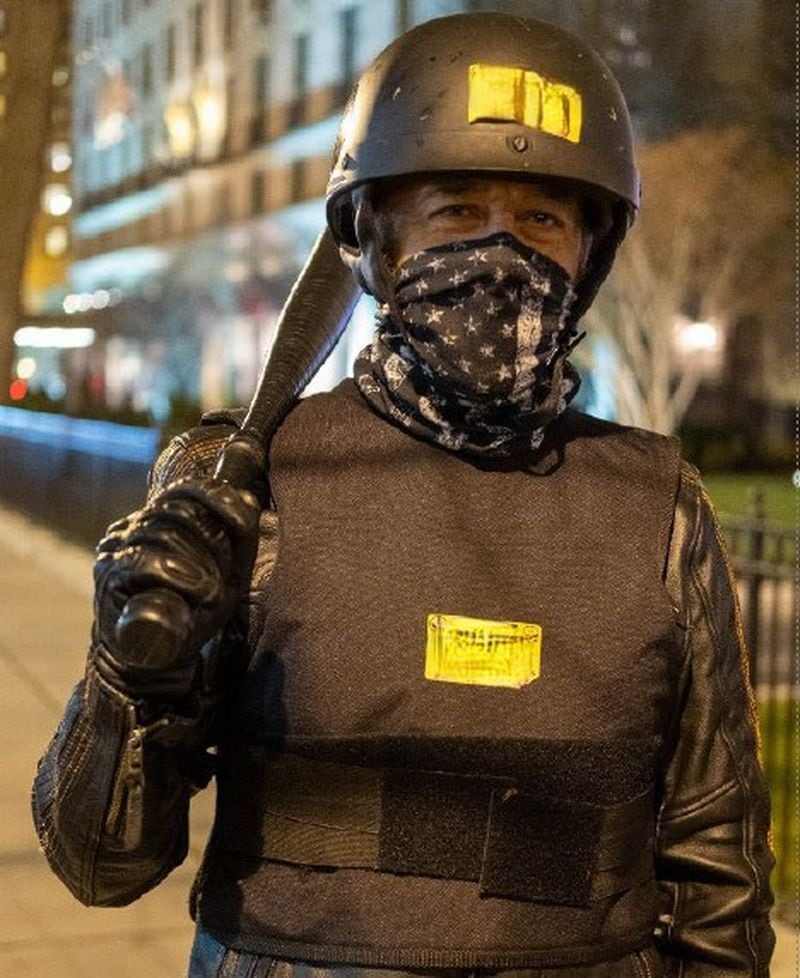 William Frederick Beals, 53, of Ringgold is seen here in a photo from Jan. 5, 2021, where prosecutors say he attended a rally in Washington to protest the certification of the 2020 presidential election. This photo has been edited to blur a profanity on the yellow stickers on his vest and helmet. (U.S. Department of Justice)