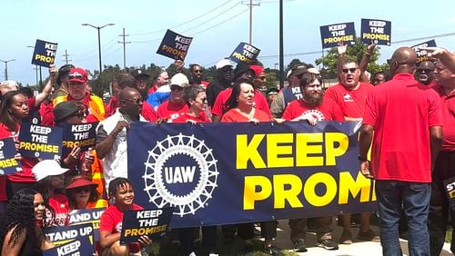 In this image from video, United Auto Workers members rally outside Stellantis' Sterling Heights Assembly Plant Friday, Aug. 23, 2024, in Sterling Heights, Mich. (AP Photo/Tom Krisher)