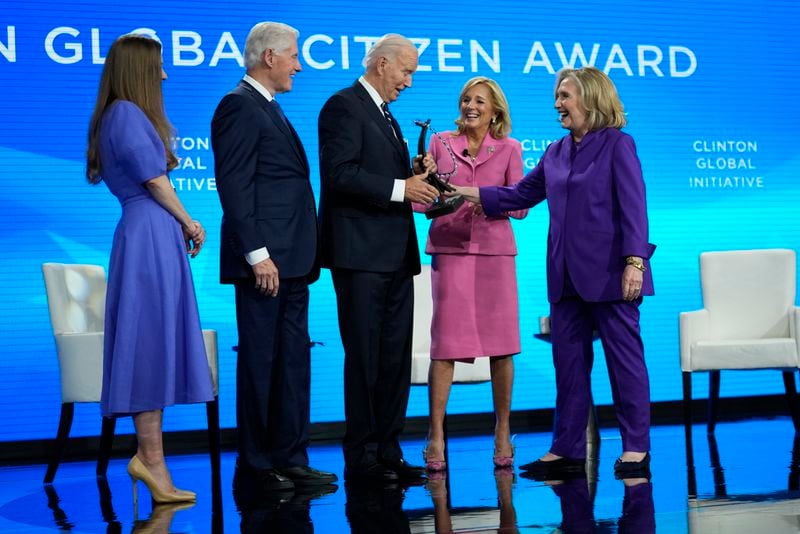 President Joe Biden is presented with the Global Citizen Award by Chelsea Clinton, former President Bill Clinton, first lady Jill Biden and former Secretary of State Hillary Clinton at the Clinton Global Initiative Monday, Sept. 23, 2024, in New York. (AP Photo/Manuel Balce Ceneta)