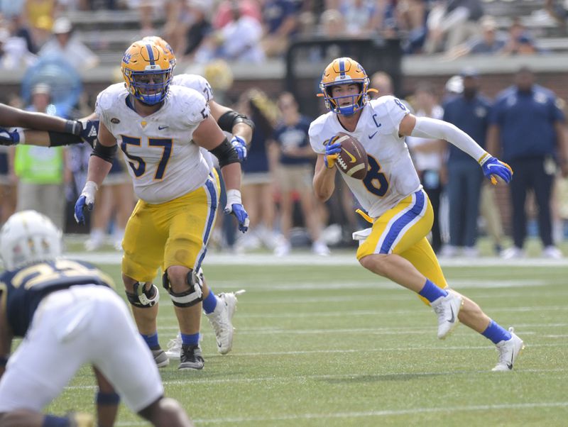 Pittsburgh quarterback Kenny Pickett throws under pressure from the Yellow Jacket defense in the second half of play during a NCAA college football game Saturday, Oct. 2, 2021 at Bobby Dodd Stadium in Atlanta. (Daniel Varnado/For the AJC)