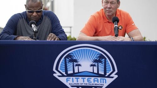 Houston Astros manager Dusty Baker, left, listens as team owner Jim Crane talks during a news conference before the start of spring training at Fitteam Ballpark of the Palm Beaches in West Palm Beach, Fla., on Thursday, Feb. 13, 2020.