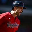 Cleveland Guardians' Lane Thomas shouts as he runs the bases after hitting a home run in the first inning during Game 1 of baseball's AL Division Series against the Detroit Tigers, Saturday, Oct. 5, 2024, in Cleveland. (AP Photo/David Dermer)