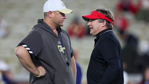 Georgia Tech coach Brent Key talks with Georgia coach Kirby Smart before their game at Bobby Dodd Stadium, Saturday, November 25, 2023, in Atlanta. (Jason Getz / Jason.Getz@ajc.com)