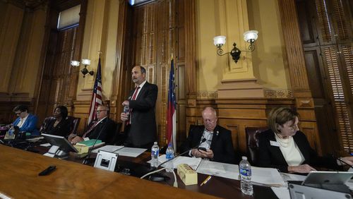 Georgia's State Election Board members discuss proposals for election rule changes at the state capitol, Friday, Sept. 20, 2024, in Atlanta. (AP Photo/Mike Stewart)