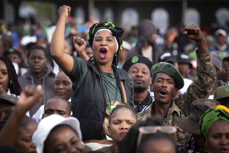 Supporters of Umkhonto weSizwe party react during an election meeting in Mpumalanga, near Durban, South Africa, Saturday, May 25, 2024, in anticipation of the 2024 general elections scheduled for May 29. (AP Photo/Emilio Morenatti)