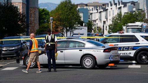 Law enforcement officials at the scene of a shooting in an apartment complex early Thursday, Sept. 12, 2024, in Broomfield, Colo. (AP Photo/David Zalubowski)