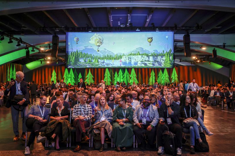 Thousands pack the Moscone South Hall in preparation for keynote speakers like CEO Marc Benioff during Dreamforce in San Francisco, Tuesday, Sept. 17, 2024. (Brontë Wittpenn/San Francisco Chronicle via AP)