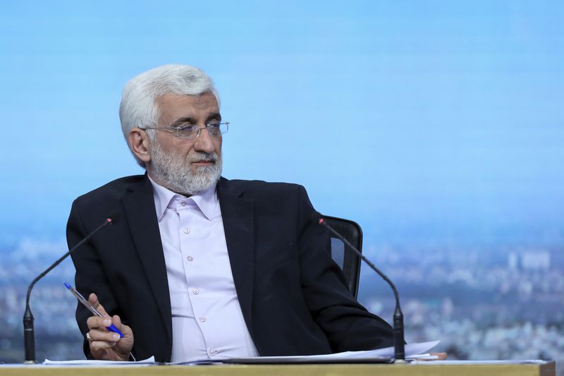 In this picture made available by Iranian state-run TV, IRIB, presidential candidate for the June 28 election Saeed Jalili, a former Iran's senior nuclear negotiator, sits in a debate of the candidates at the TV studio in Tehran, Iran, Tuesday, June 25, 2024. (Morteza Fakhri Nezhad/IRIB via AP)