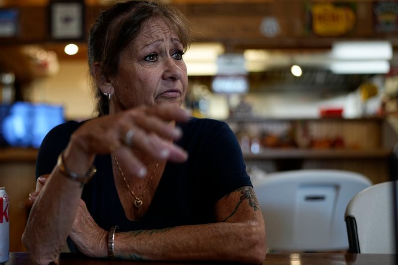 FILE - Karen Goodwin reflects on the life of her son, Austin Hunter Turner, as she rests at a roadside market during a motorcycle ride along U.S. Highway 421, Friday, Sept. 22, 2023, in Shady Valley, Tenn. Turner died in 2017 after an encounter with the Bristol Police Department. (AP Photo/George Walker IV, File)