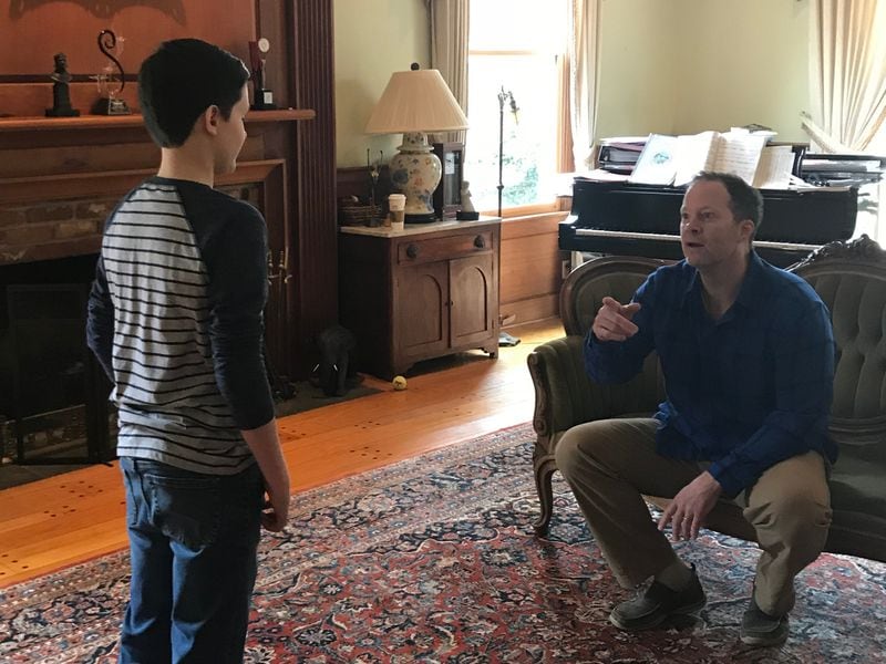 Shuler Hensley (right), Tony Award-winning actor and associate artistic director of the City Springs Theatre company, works with student 
Lukas DeLancey.