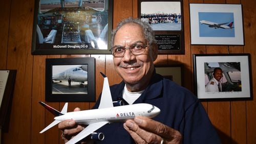 Julius Alexander at his office in 2017. Alexander started out wanting to fly, but it wasn't easy. After struggling to find the time and money for flying lessons, Alexander eventually got his pilots license -- and ended up teaching dozens of other young people to fly in Atlanta through the Aviation Career Enrichment (ACE) program. HYOSUB SHIN / HSHIN@AJC.COM