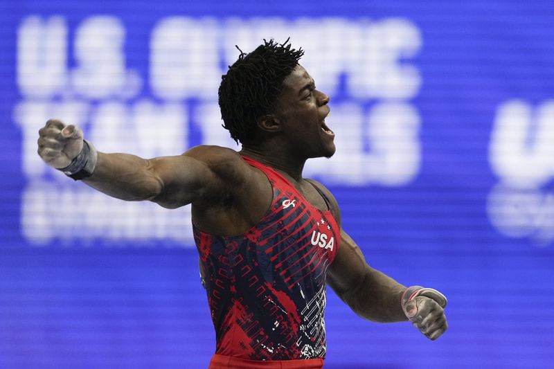 Frederick Richard celebrates after competing on the pommel horse at the United States Gymnastics Olympic Trials on Saturday, June 29, 2024, in Minneapolis. (AP Photo/Charlie Riedel)