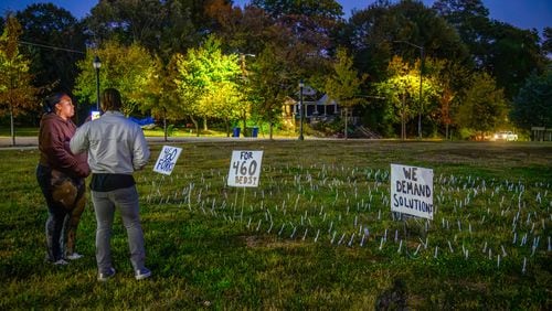 Protesters plant 460 forks in the ground outside of the closed Atlanta Medical Center on this, the anniversary of it's closing. November 1, 2023 (Jamie Spaar for the Atlanta Journal Constitution)