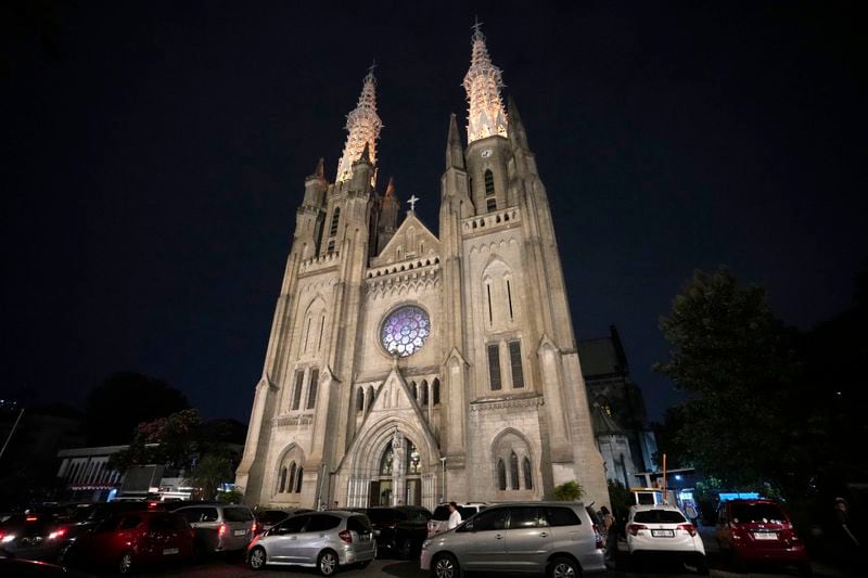 The Church of Our Lady of the Assumption, popularly known as the Jakarta Cathedral is illuminated during dusk in Jakarta, Indonesia, Thursday, Aug. 8, 2024. (AP Photo/Achmad Ibrahim)