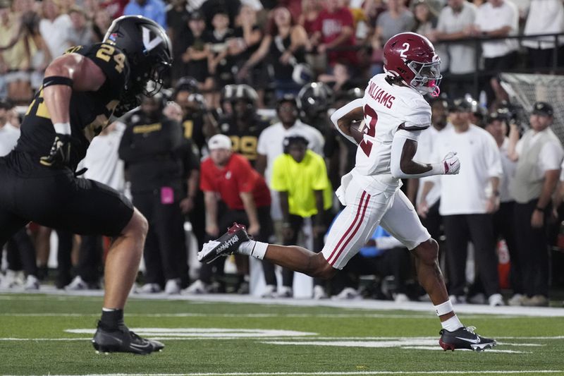 Alabama wide receiver Ryan Williams (2) runs into the end zone for a touchdown past Vanderbilt linebacker Nicholas Rinaldi (24) during the second half of an NCAA college football game Saturday, Oct. 5, 2024, in Nashville, Tenn. (AP Photo/George Walker IV)