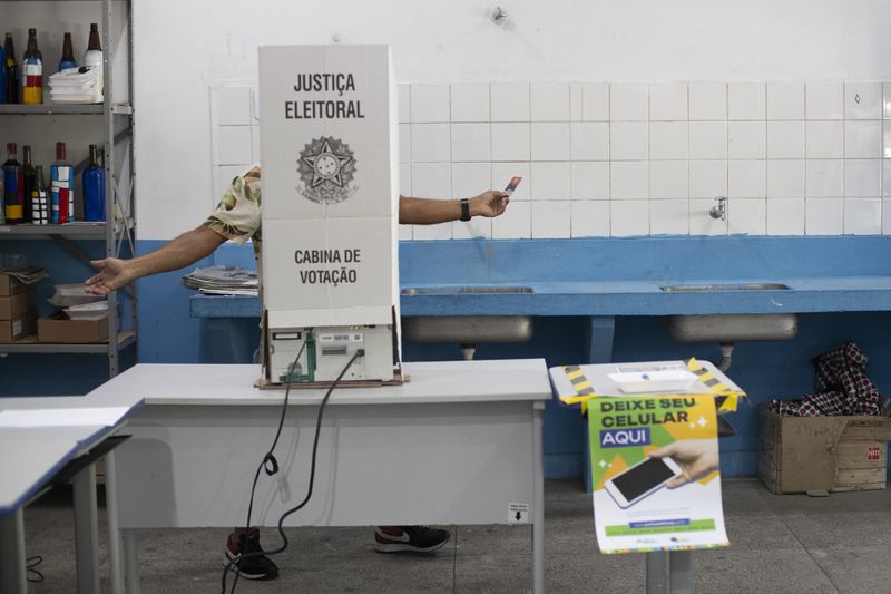 A man votes in municipal elections in Rio de Janeiro, Sunday, Oct. 6, 2024. (AP Photo/Bruna Prado)